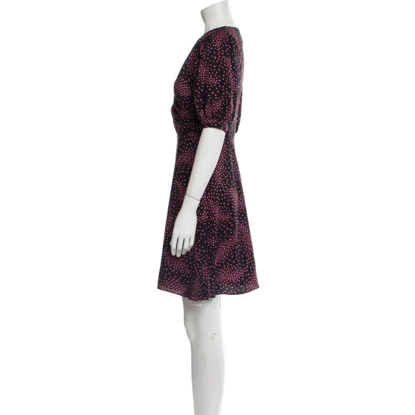 Mannequin wearing a patterned dress on a white background