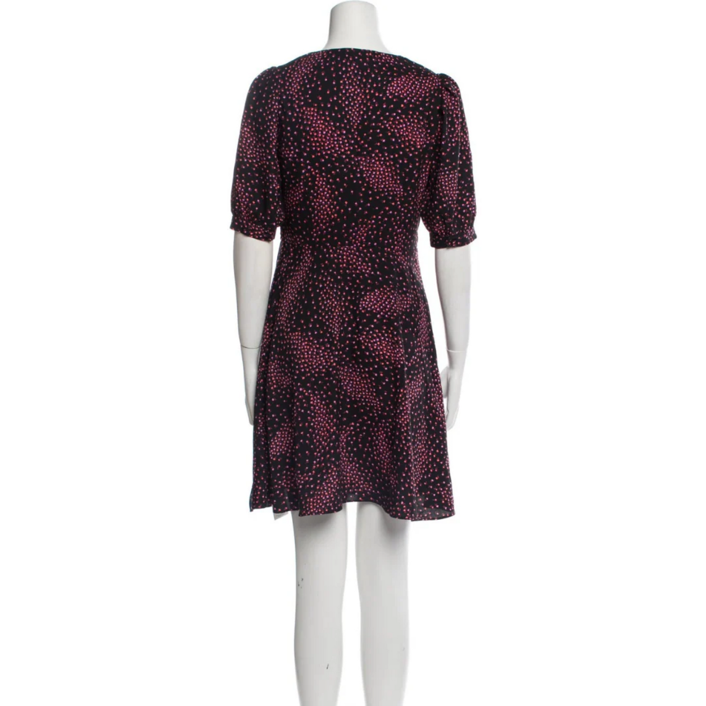 Mannequin wearing a patterned dress on a white background