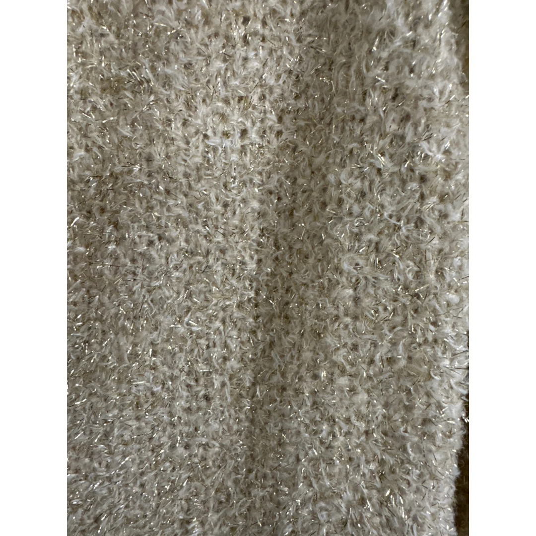 Close-up of textured gold fabric with a subtle pattern