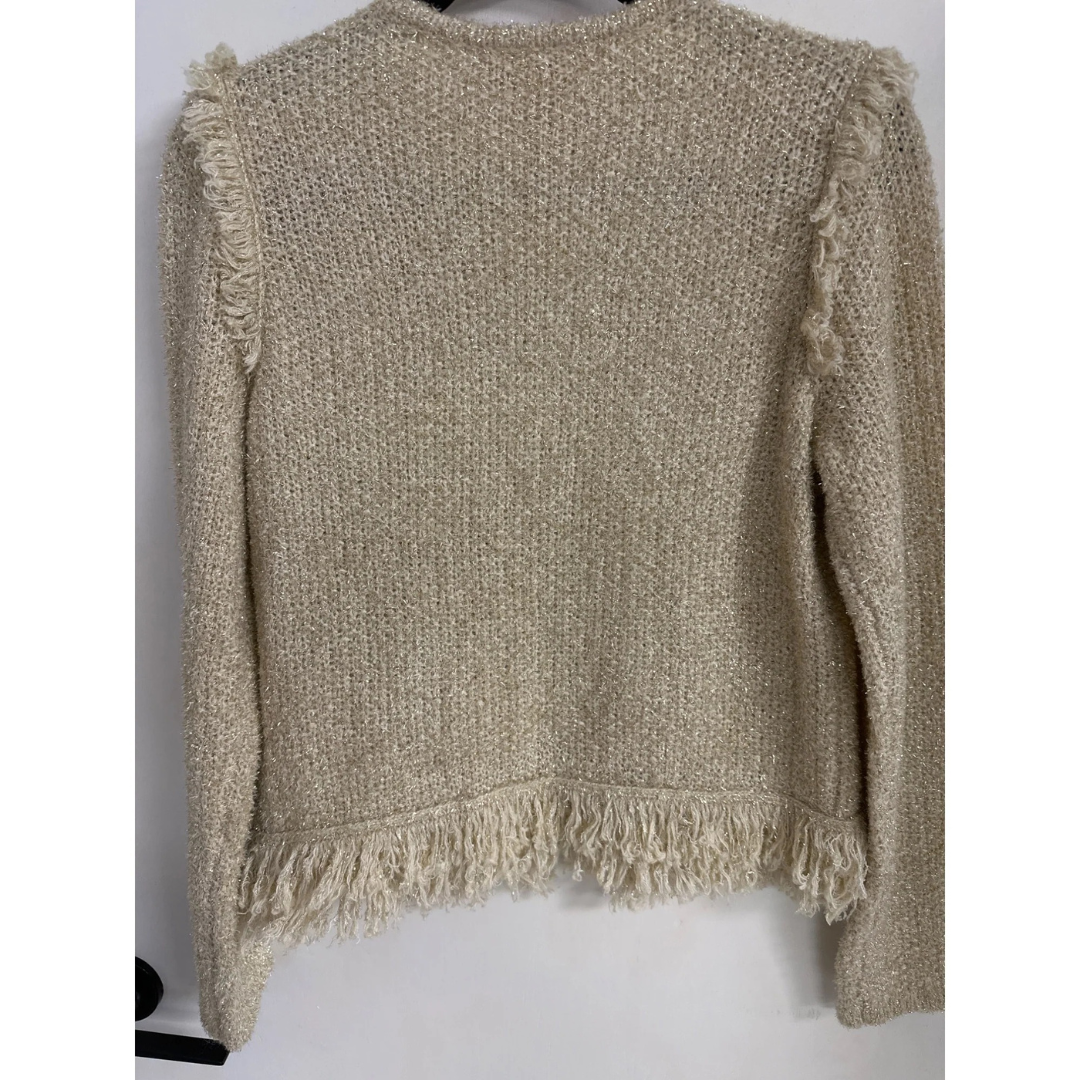 Gold knitted sweater with fringe edges on a white background