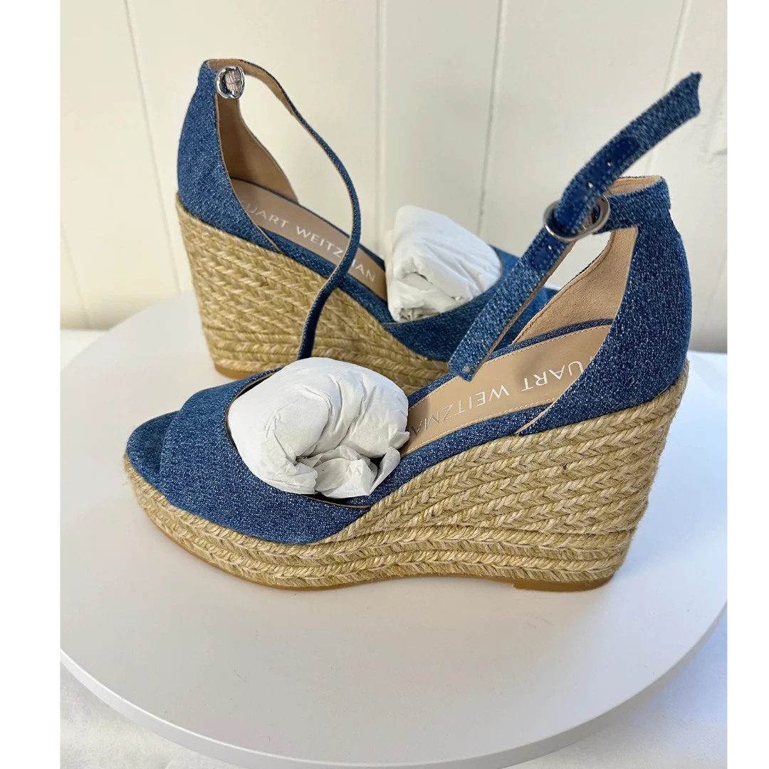 Stuart Weitzman shown with side view on a white surface