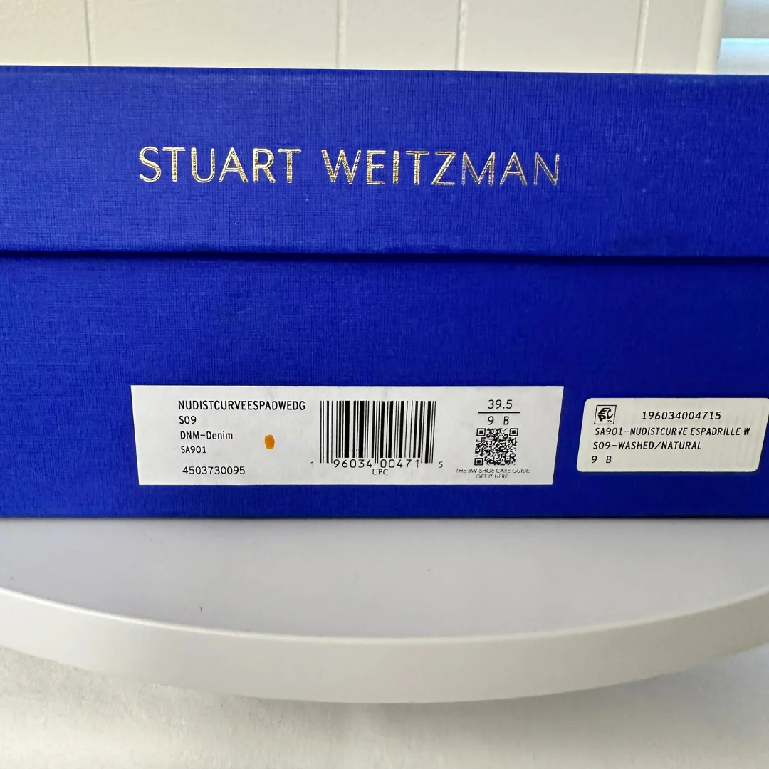 Stuart Weitzman shoe box with label on a white background