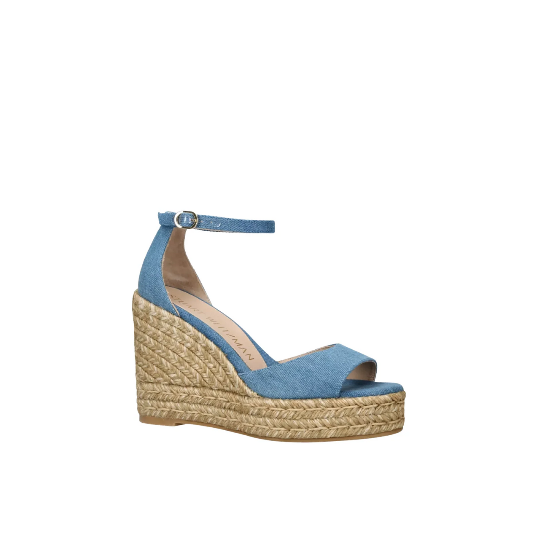 Stuart Weitzman sandal with jute sole slightly angled on a white background