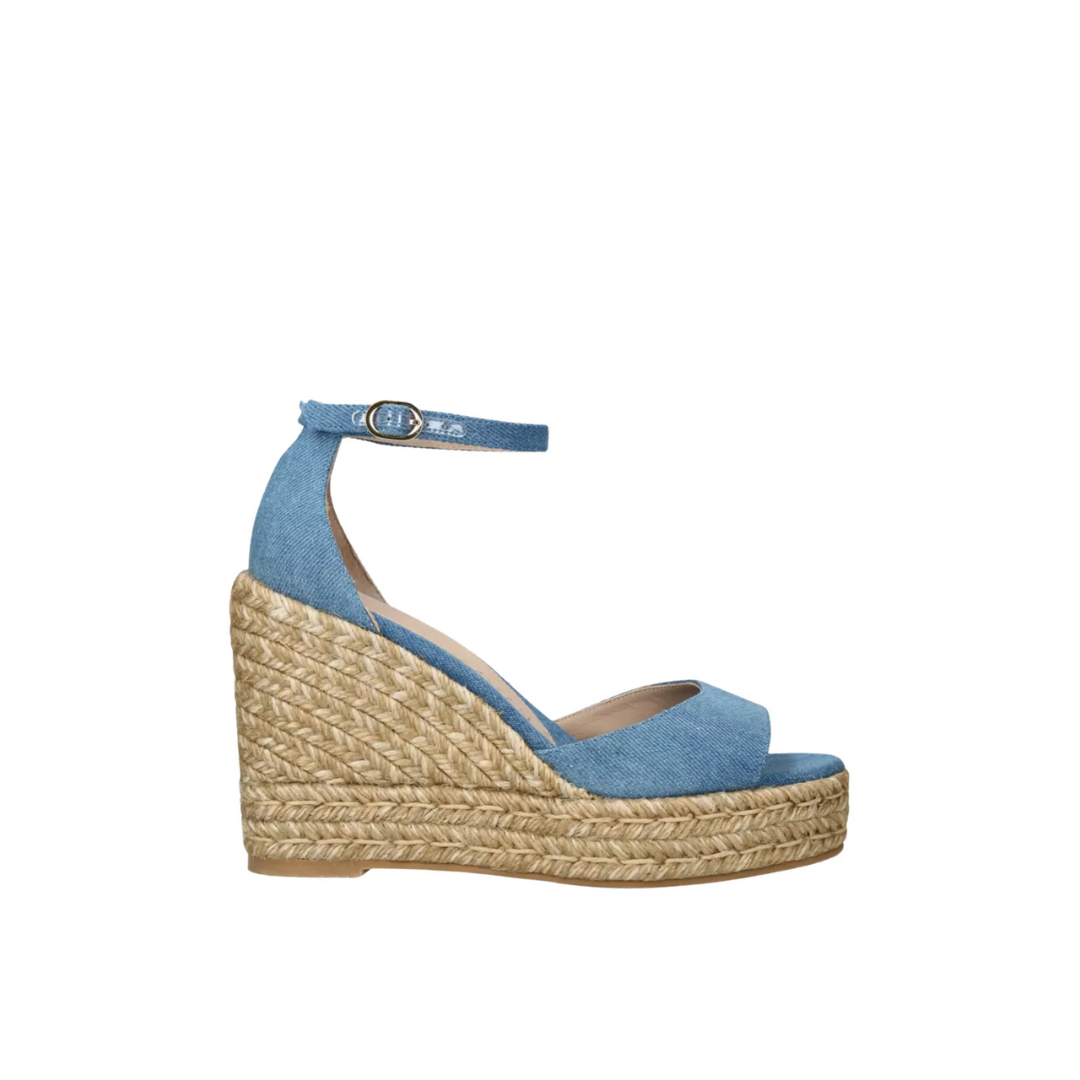 Blue wedge sandal with jute sole on a white background
