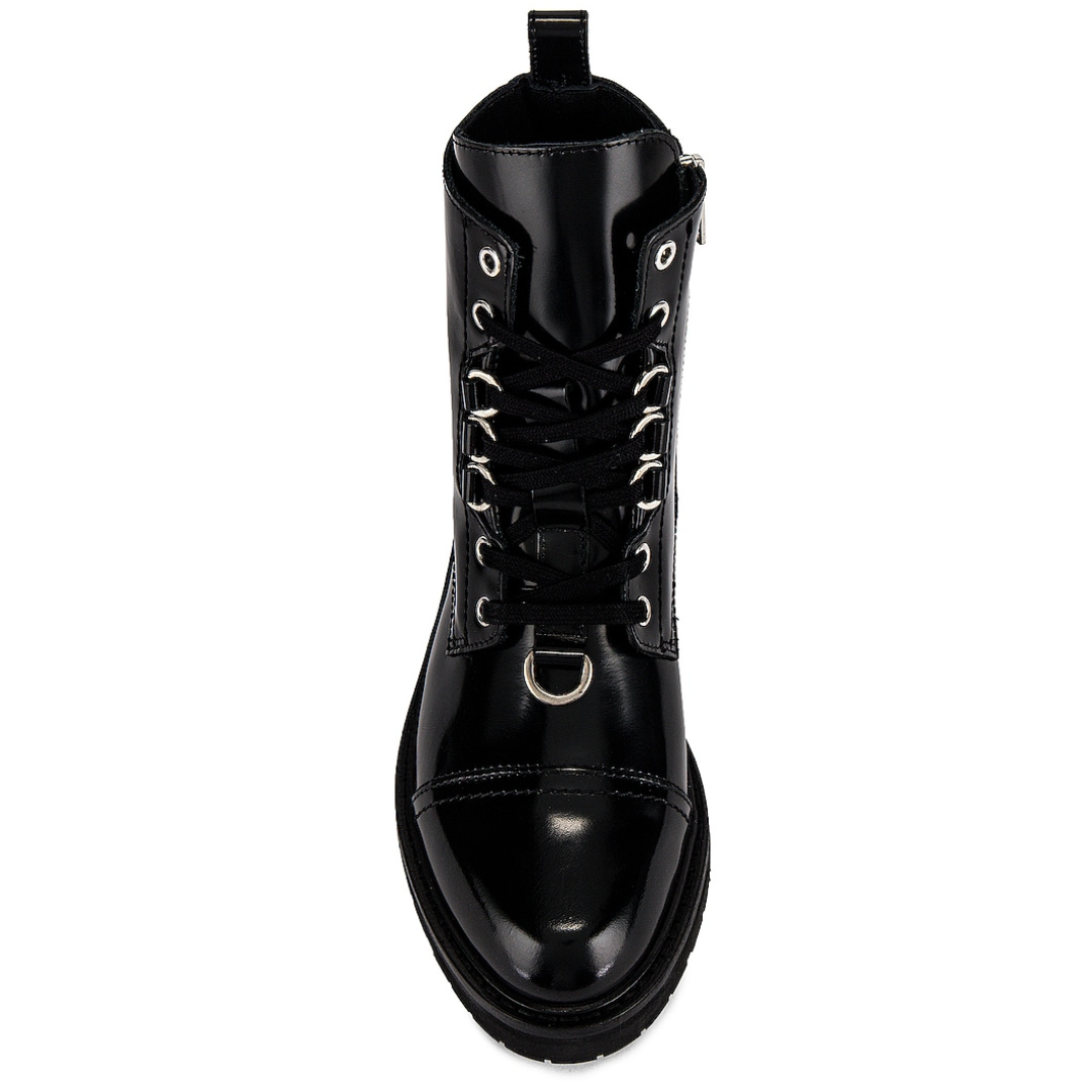 Black leather boot with detailed design on a white background