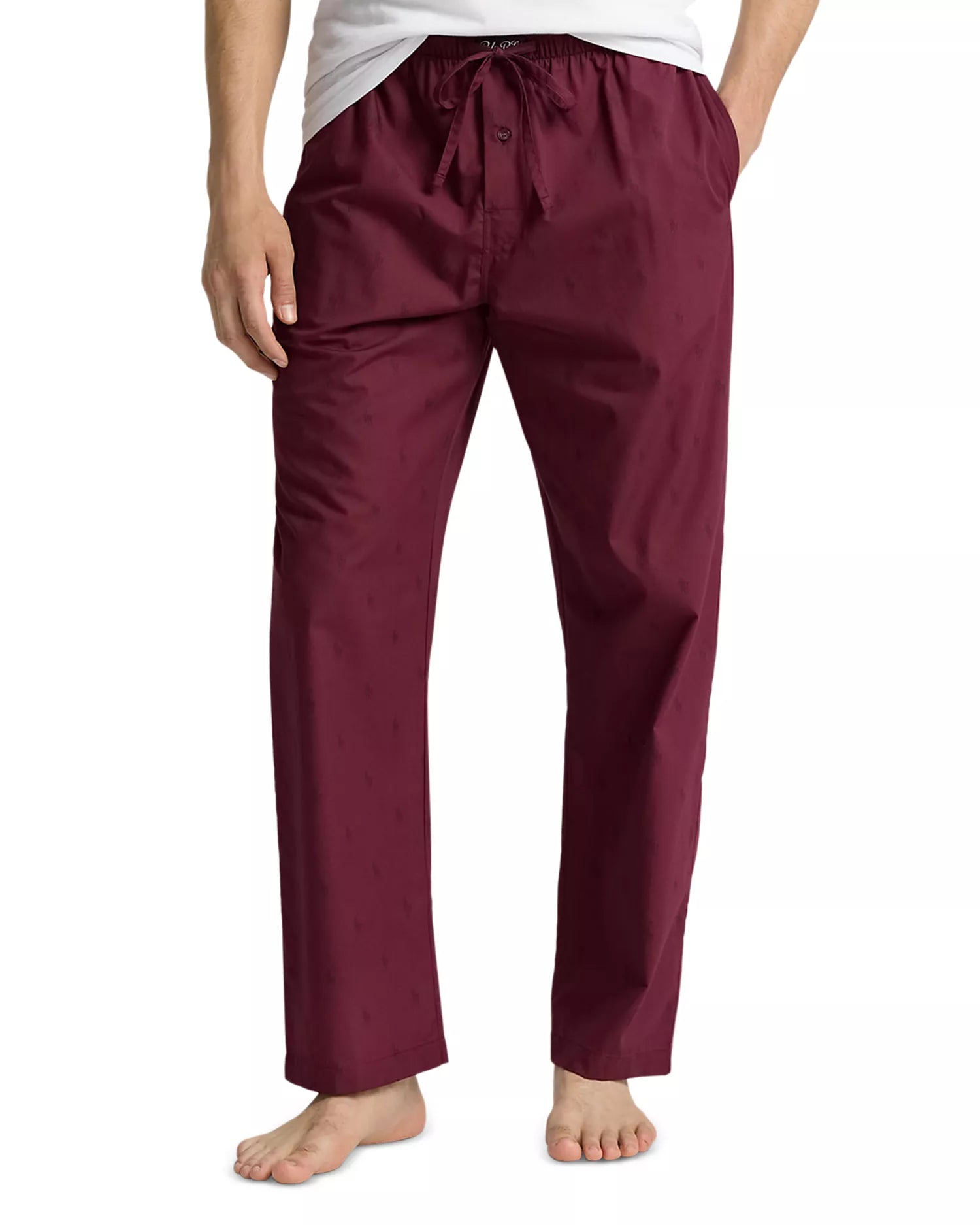 Pajama pants worn by a person on a white background