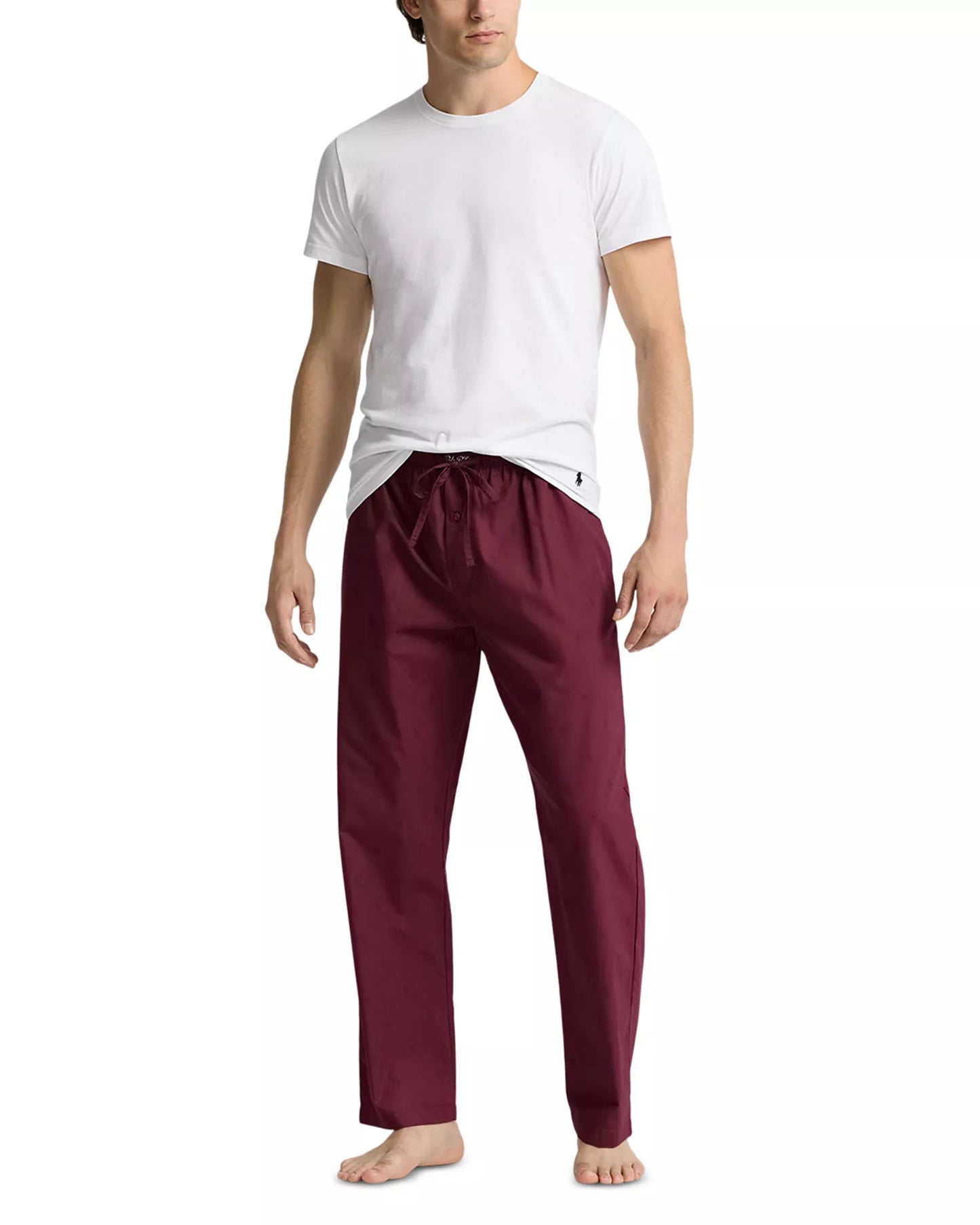 Polo Ralph Lauren men's wine pajama pants featuring an allover blue pony print, modeled with a white t-shirt on a white background.