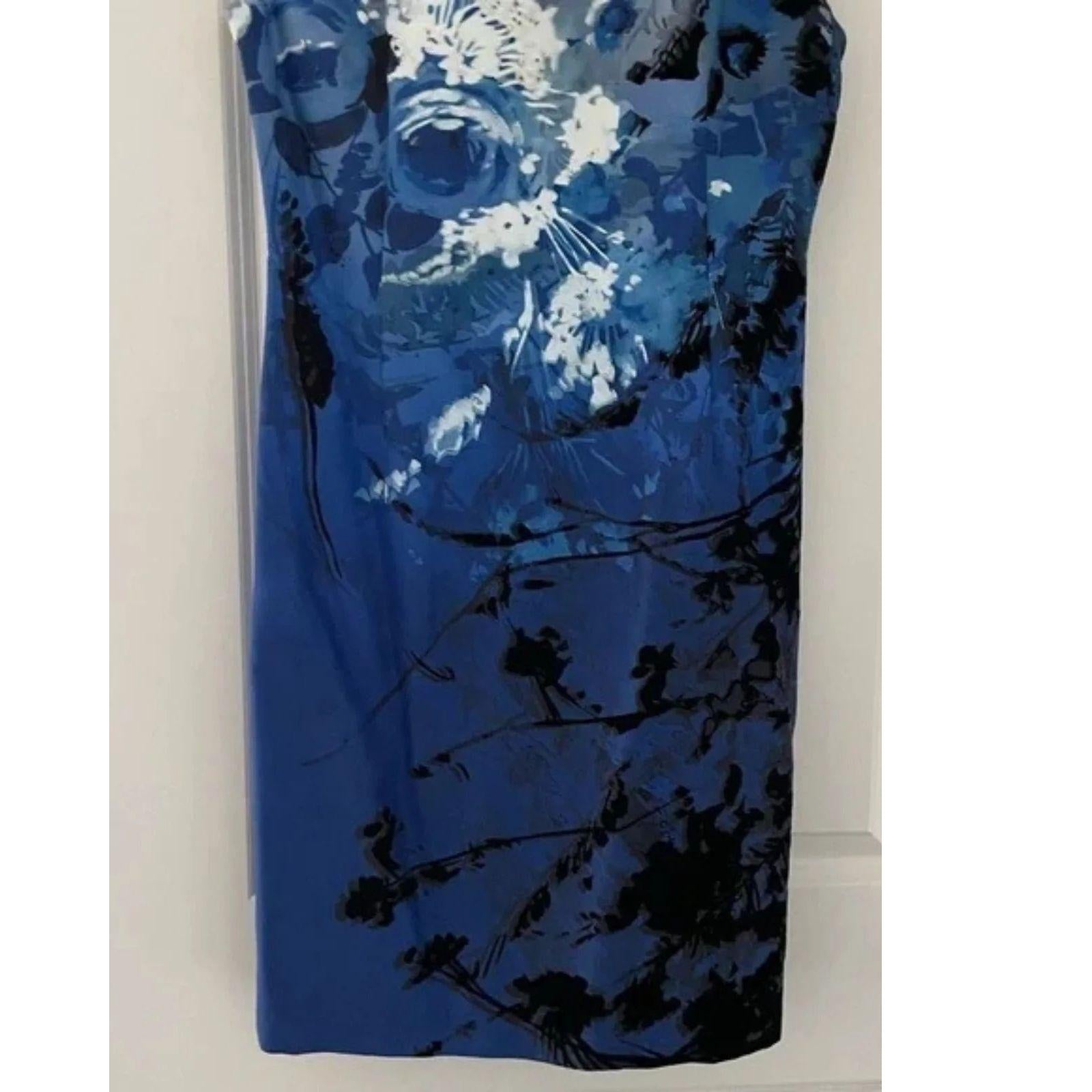 Blue floral dress with black and white flowers on a white background