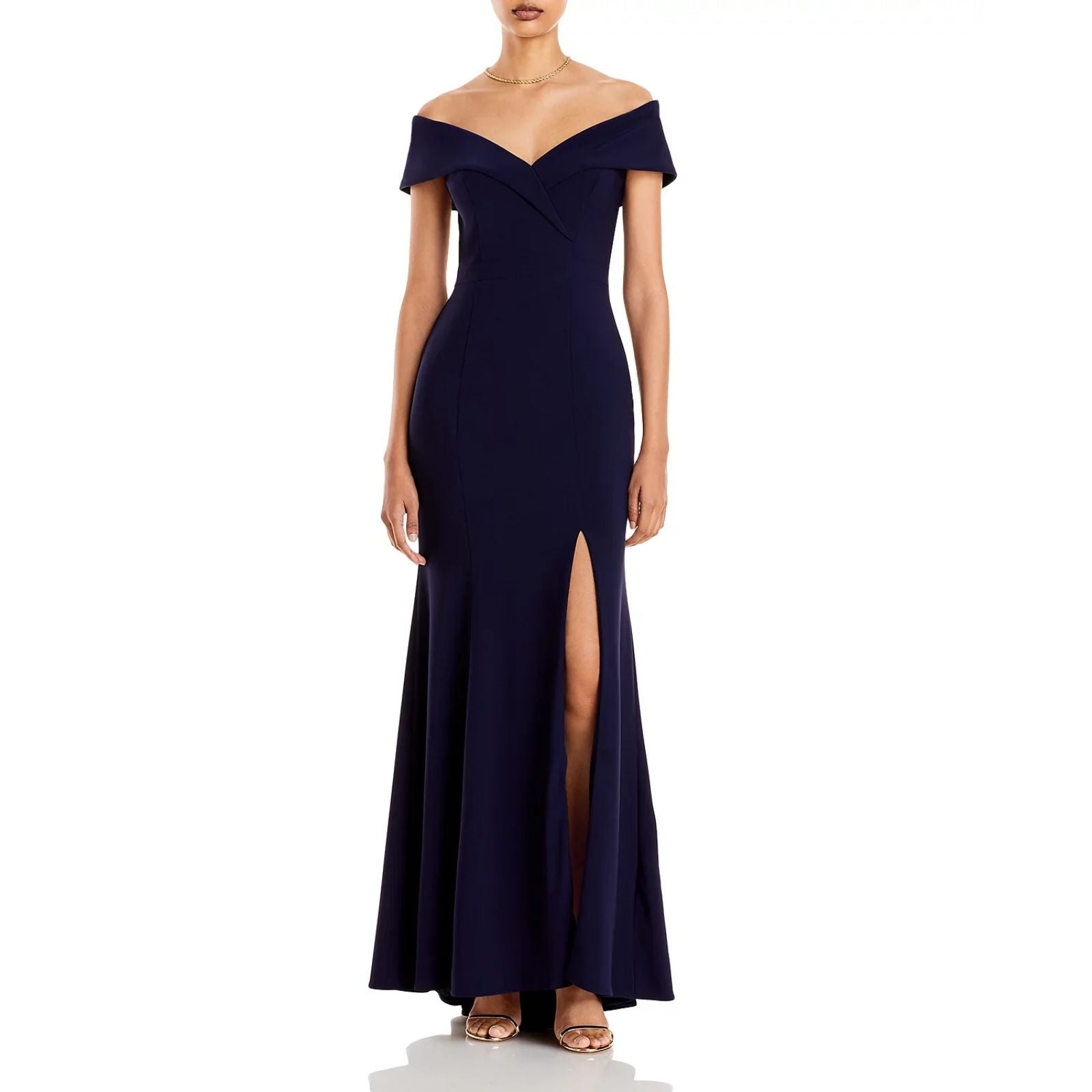 Navy off-shoulder gown with a slit on a white background