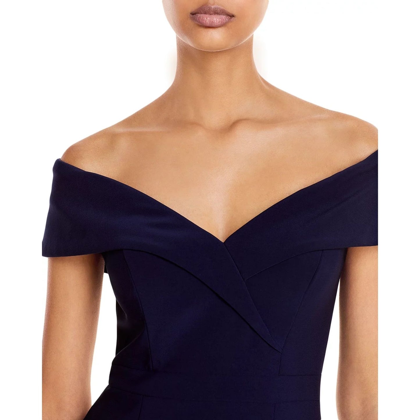 Upclose photo of shoulders and upper torso of Navy blue off-shoulder dress on a model with a white background