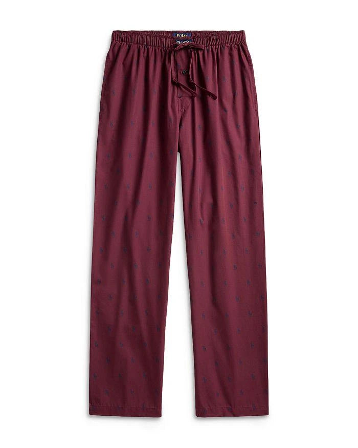 Polo Ralph Lauren men's wine colored pajama pants with an allover blue pony print design on a white background.