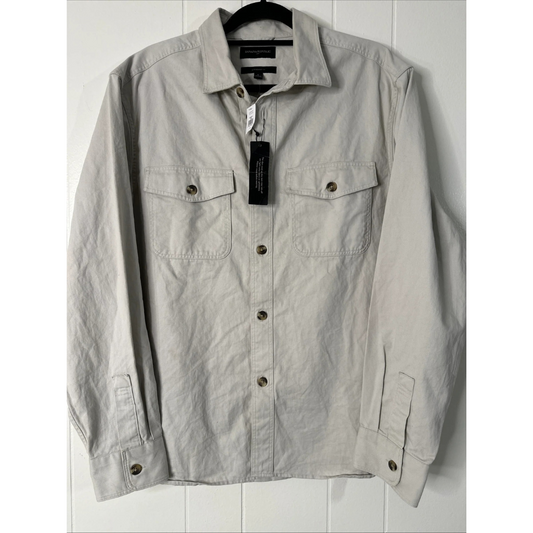 Shirt with buttons on a hanger against a white background