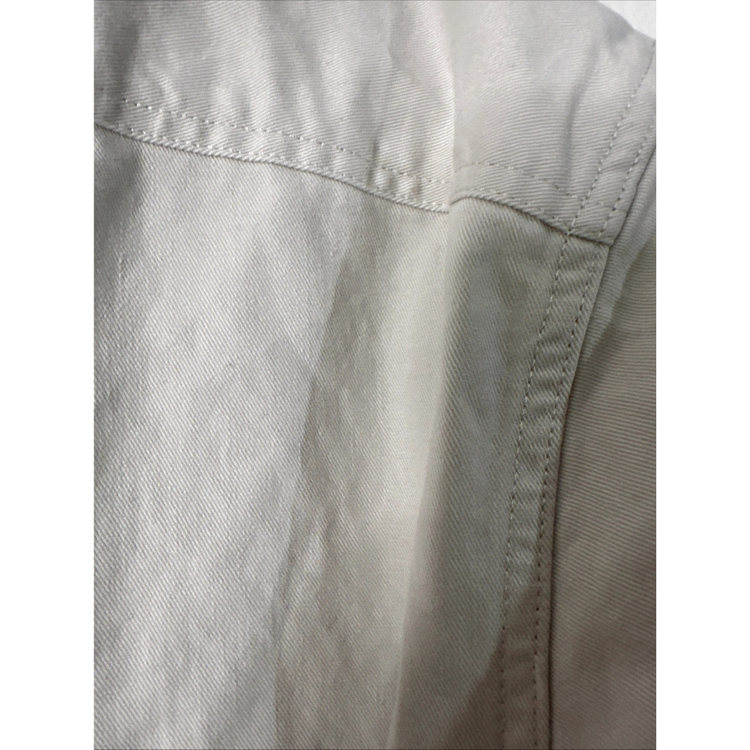 Close-up of a beige fabric texture with stitching details