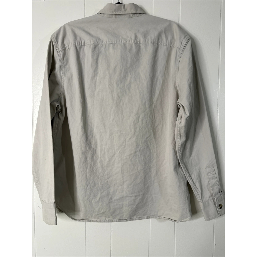 back view of stone color shirt  on a white wooden background