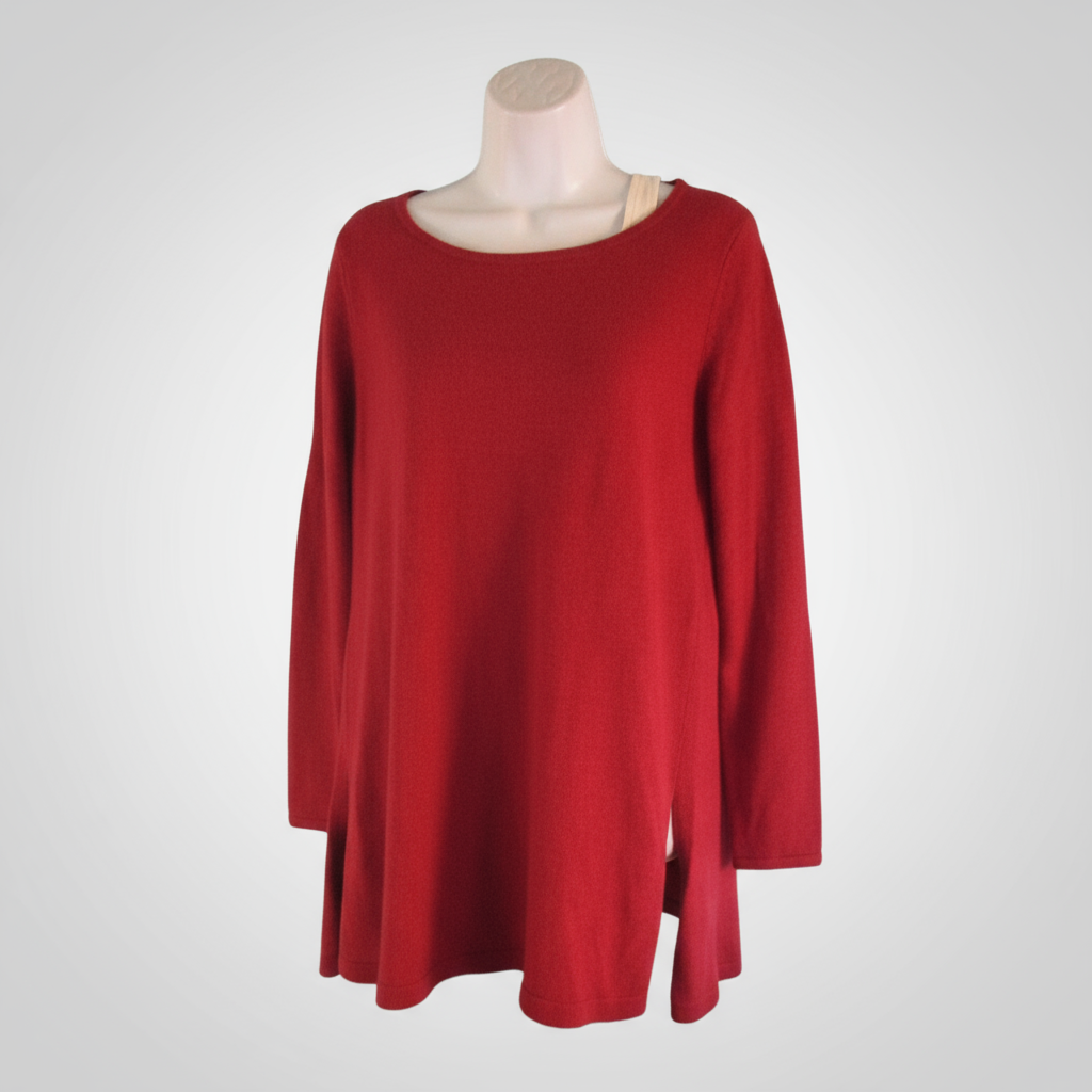 Red sweater on a mannequin against a white background