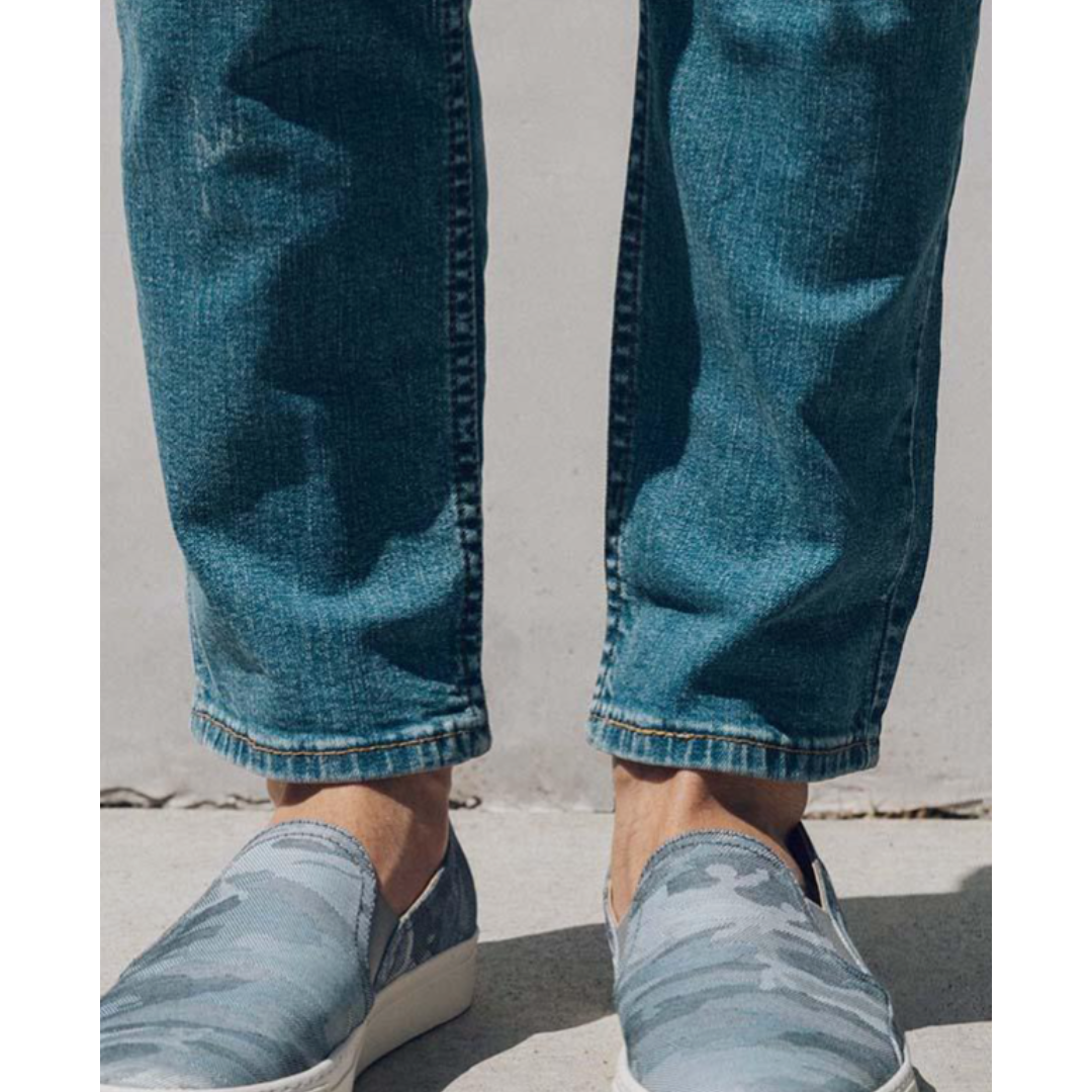 Man wearing  shoes with jeans