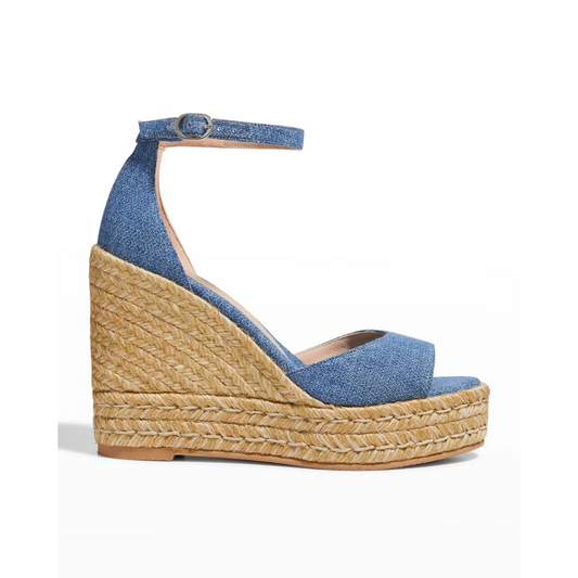 Stuart Weitzman blue wedge sandal with jute sole on a white background side view