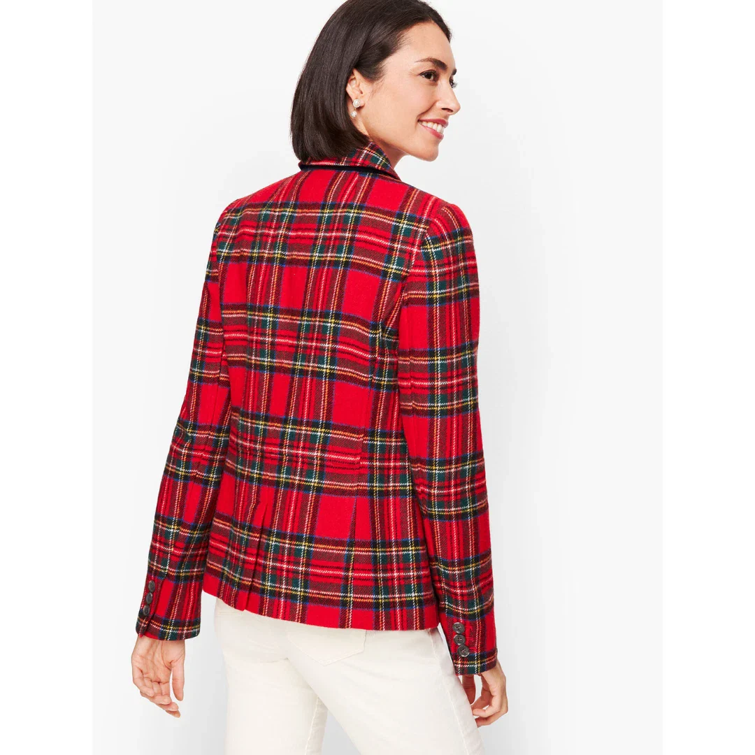Woman wearing a plaid blazer, back view on a white background