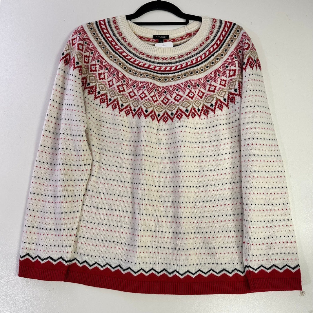 White sweater with red and black pattern on a hanger against a white background