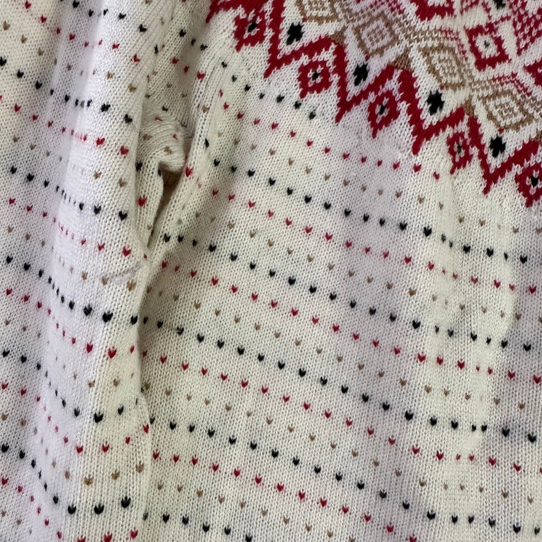 Close-up of a fabric with red and black patterns on a white background