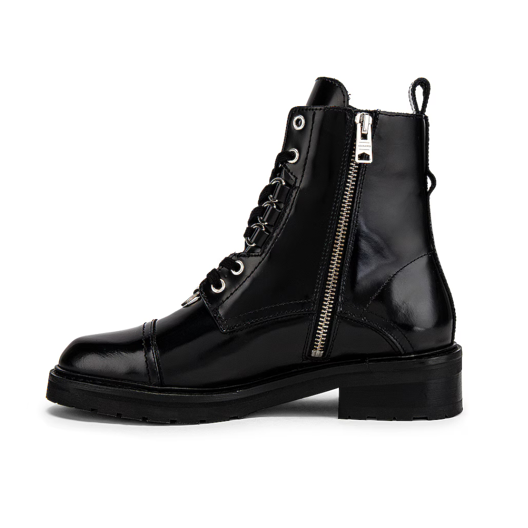 Black leather boot with zipper on a white background