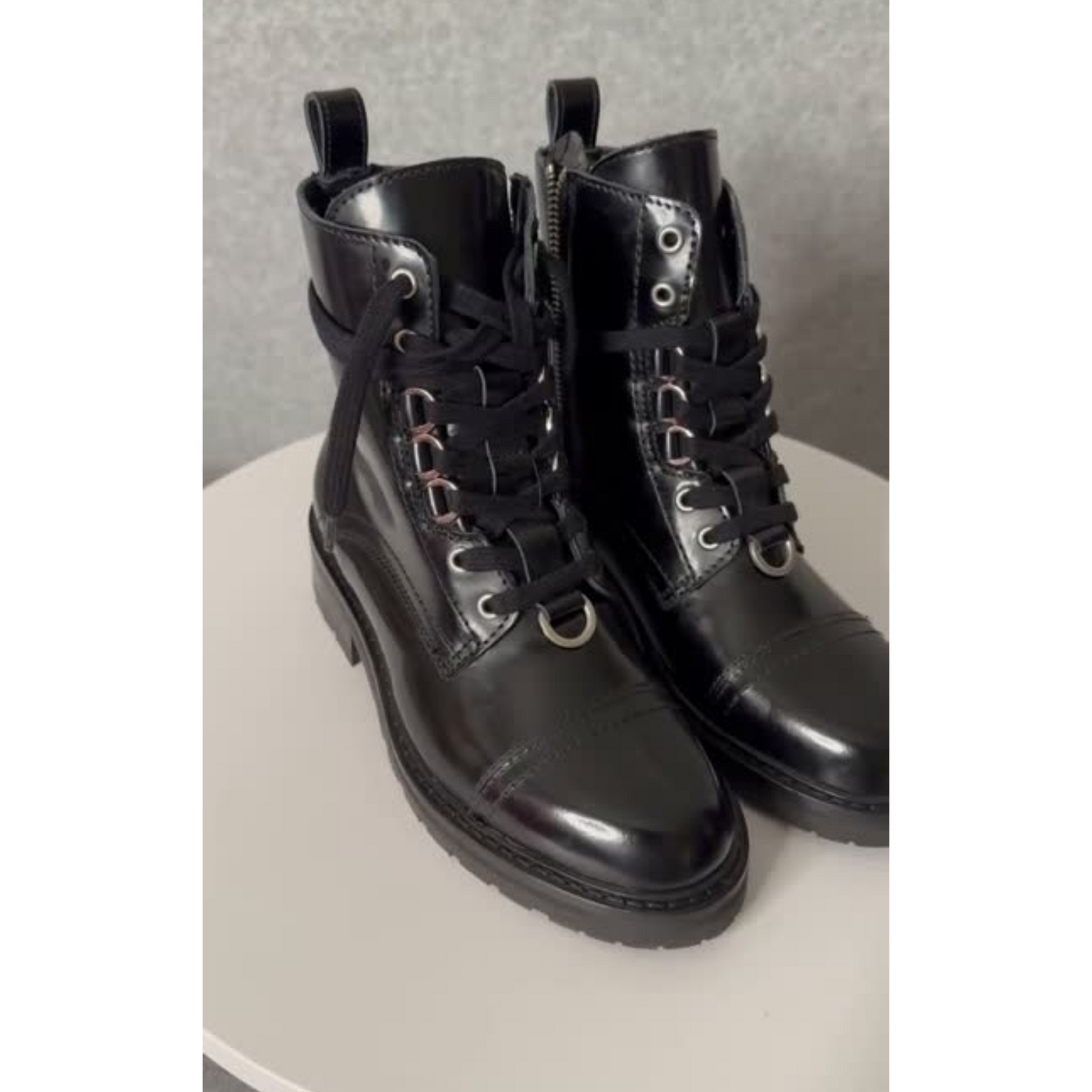 Side and front view black leather boots