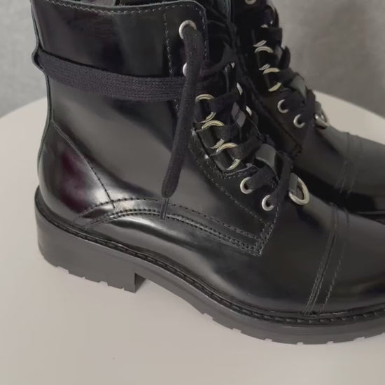 video of boots on a turn table spinning showing boots
