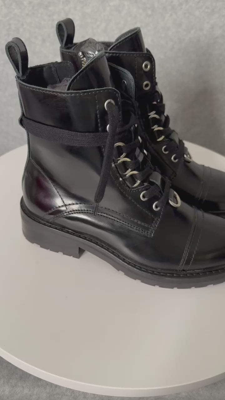 video of boots on a turn table spinning showing boots
